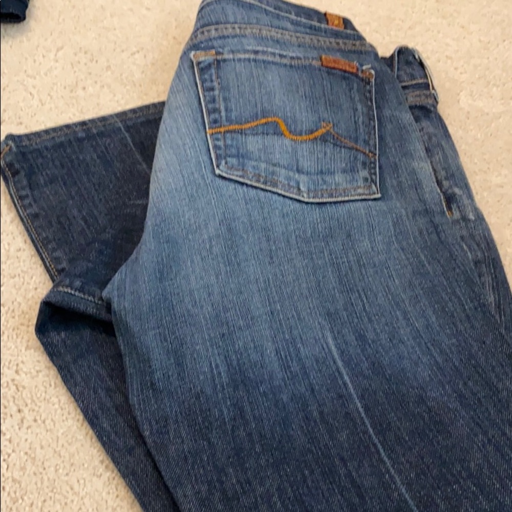 Distressed boot cut jeans